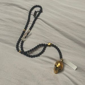 Black and gold skull necklace